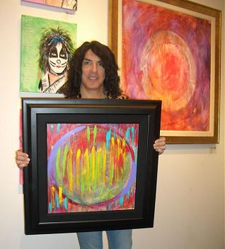 Paul Stanley with some of his original artworks